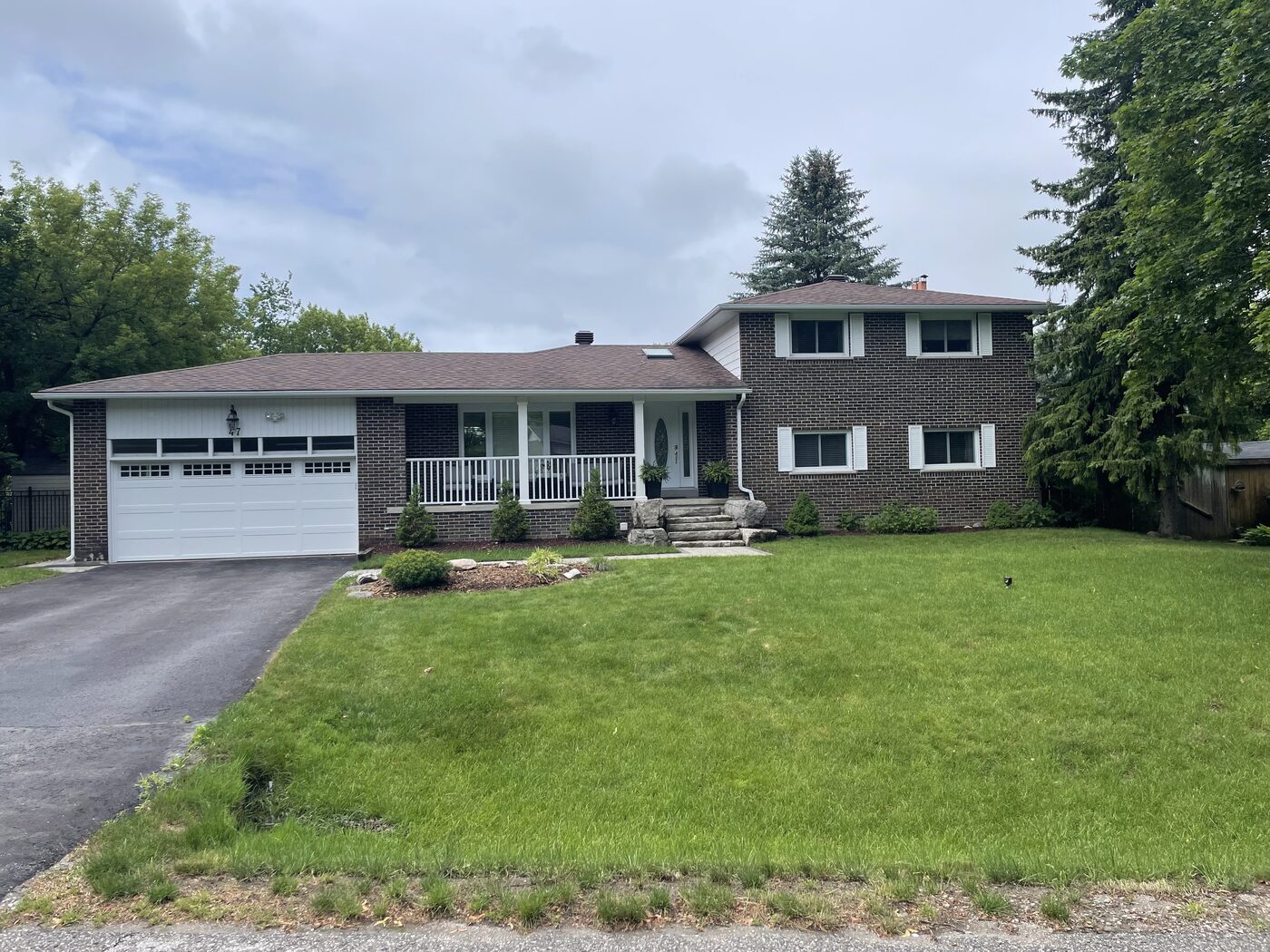 Freshly maintained lawn in front of a split-level home